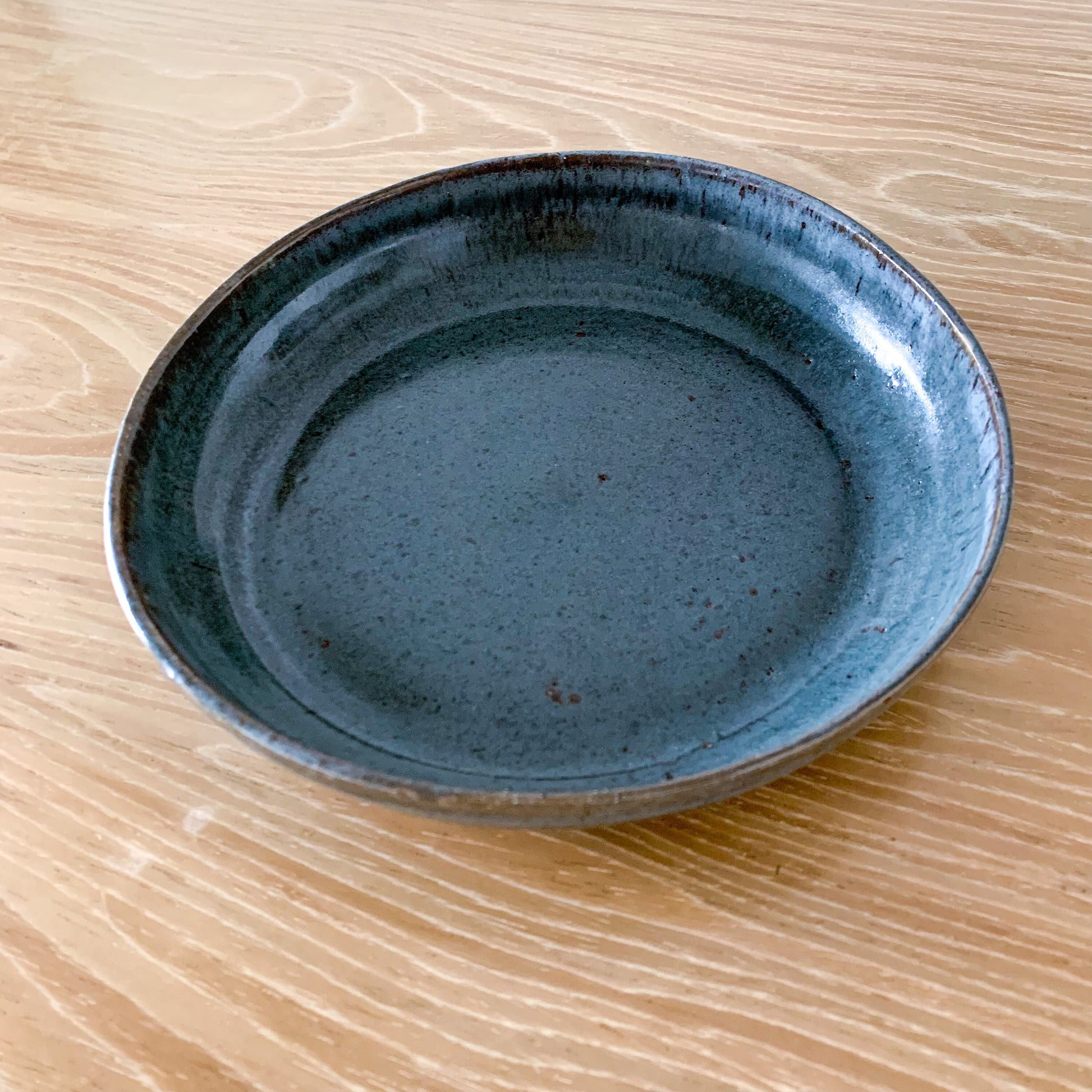 Pottery plate in blue color